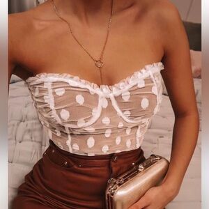 Majorelle bodysuit. Does have some makeup on it but can come off wash in wash